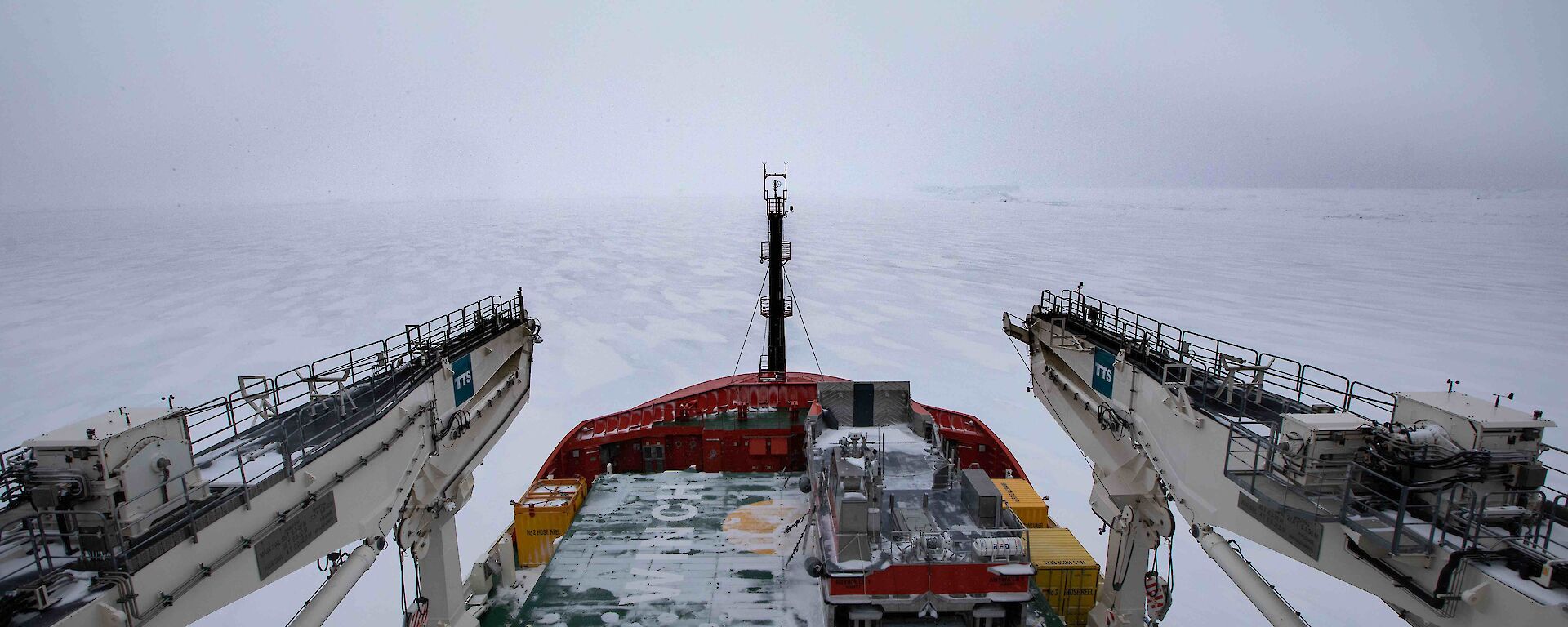 The front of a ship covered with snow