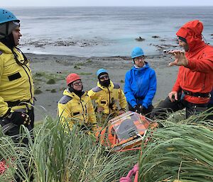 Expeditioners undertaking search and rescue training on a slope