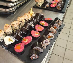 A couple of trays of freshly made sushi