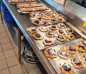 Lots of trays of freshly baked pastries