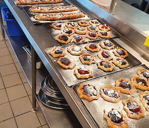 Lots of trays of freshly baked pastries