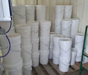 White plastic tubs contain flour