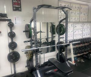 A half rack of weights in a gym