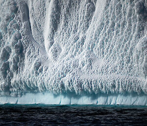 Base of an ice cliff covered in blizz snow