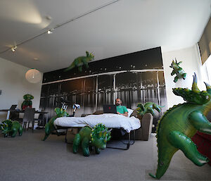 Inflatable triceratops toy in many locations around hotel room