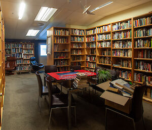 A large room with floor to ceiling books in book shelves