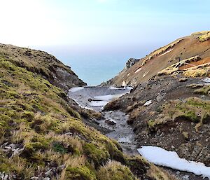 A frozen dam on the top of a hill