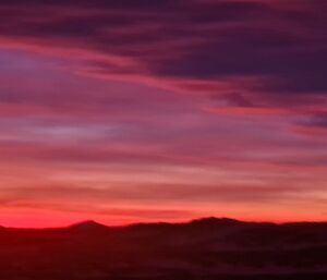 Purple and pink colours in the sky with clouds