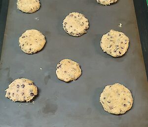 Balls of dough placed onto baking sheet ready for baking