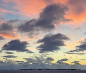 Clouds with orange, yellow and blue in the sky