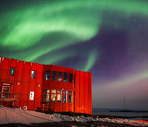 Aurora over the red shed accommodation building