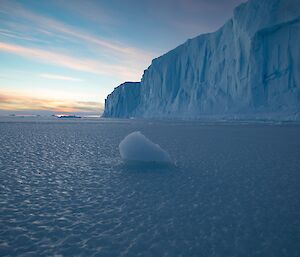 Looking across the sea ice at large tabular iceberg