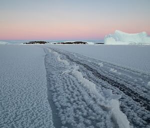 Large crack in the sea ice extends from front right of photo all the way to the horizon