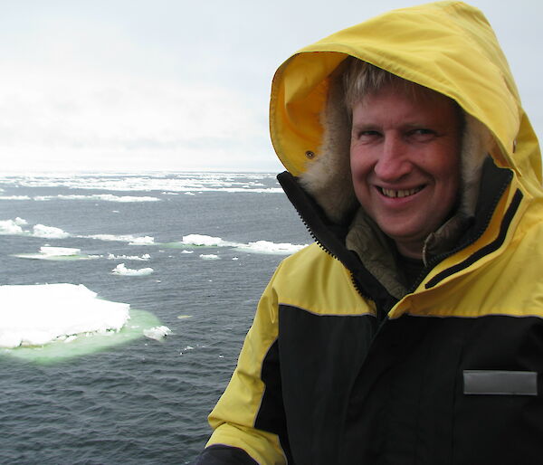 man on ship with icebergs
