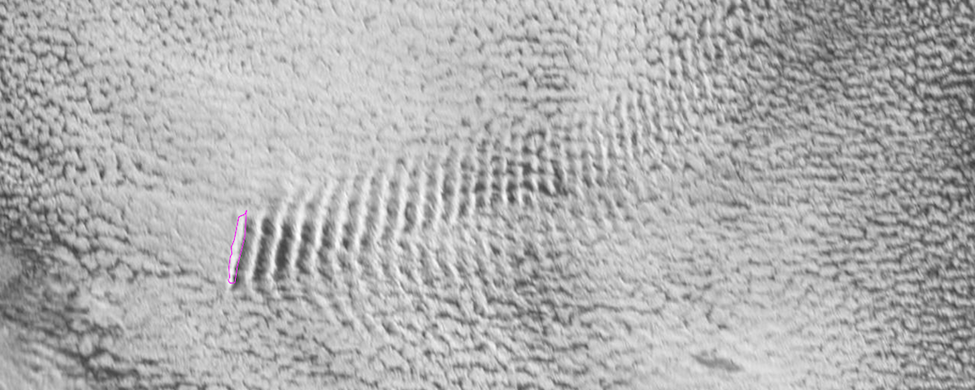 A Satellite image of a mountain cloud down wind