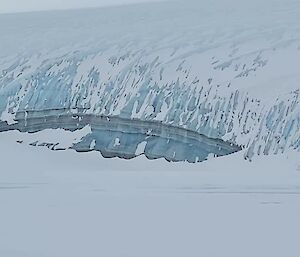 Zoomed in photo of the glacier showing various colours of blue