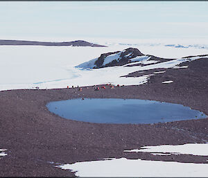 Small field camp near lake