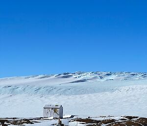 Looking from station across to the ice plateau with blue sky above with no cloud