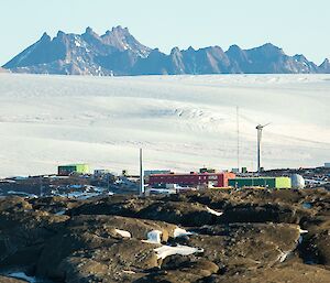 View of Mawson station from top of local island, with ice plateau and Mt Henderson in distance