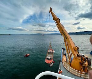 A LARC,(half truck, half boat) being lowered into the sea near Hobart.