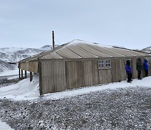 An old wooden hut in snow