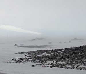 Looking over the landscape with reduced visibility due to blowing snow and high winds