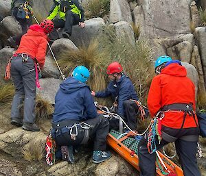 Group of people conducting mountain rescue training