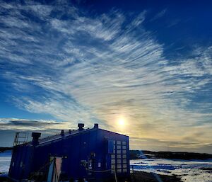 Casey's small blue balloon shed with cirrus and altocumulus cloud