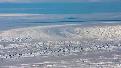 Icy river stretching to the horizon