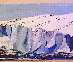 Painting of a blue and white iceberg.