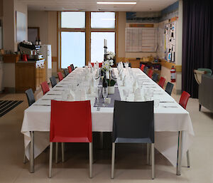 A long table is set for a formal dinner