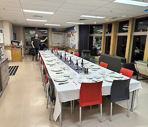 A long table is set for a formal dinner