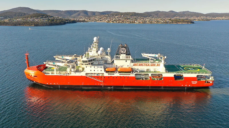 An aerial view of a large icebreaker, RSV Nuyina on Hobart’s River Derwent