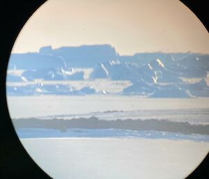 A view of ice-bergs through the lense of a telescope