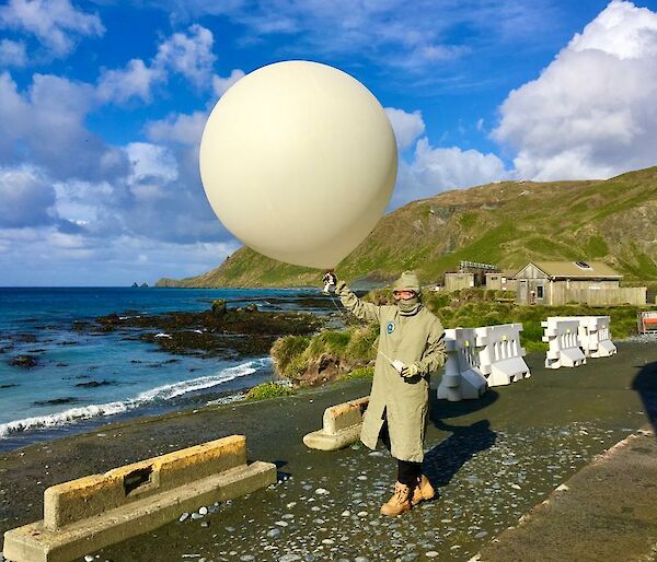 Rachel releases a balloon with a sonde attached to measure the atmospheric conditions.