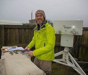 Damien taking ozone observations on the Dobson spectrophotometer.