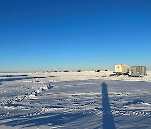The drill operators cabin which was relocating 30 of the ice core boxes. In the background is a mixture of the cargo, fuel tanks and living quarters, some of which have been relocated to flat ground. Some have not yet and you can still see some of the metres-high snow mounds that the sleds make in just a short period of time.