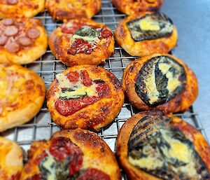 Freshly made mini pizzas of many varieties including eggplant, sundried tomato and pepperoni