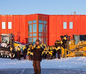 A single expeditioner stands out in front of the rest of the group