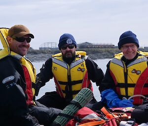 Close up of three people in life jackets