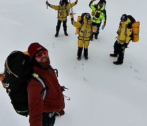 Survival training selfie of expeditioners wearing full survival attire
