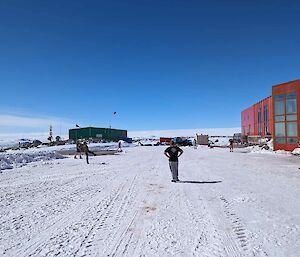 More people kicking the footy outside the Casey Red shed on the ice