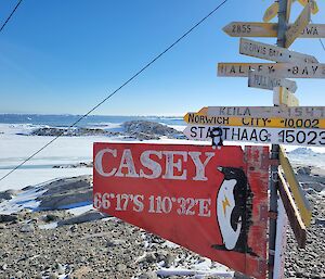 A stuffed cat toy on the Casey Station sign