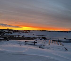 a landscape depicting vibrant colours as the sun goes below the horizon