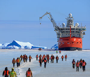 Expeditioners walking over sea ice to Station
