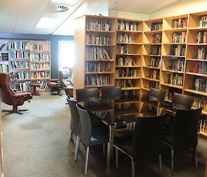 A room lined with shelves with books on them.