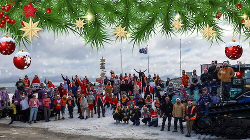 The team of Casey station standing outside waving at the camera, most people are wearing a themed Christmas hats and clothing. The image has been edited to show Christmas themed decorations.