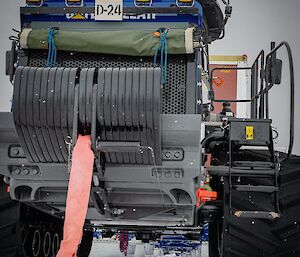 Photo taken from beneath a tractor parked on snow