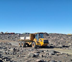 A large yellow truck carrying concrete