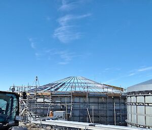 A water tank with scaffolding surrounding it